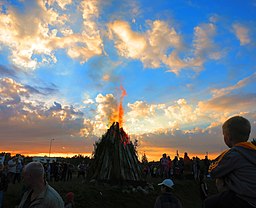 Crowd watching a bonfire on Midsummer Eve