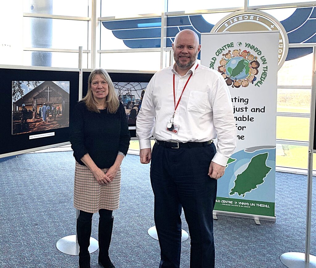 Wendy Shimmin, One World Centre Coordinator, with Airport Director Geoff Pugh at the launch of the display
